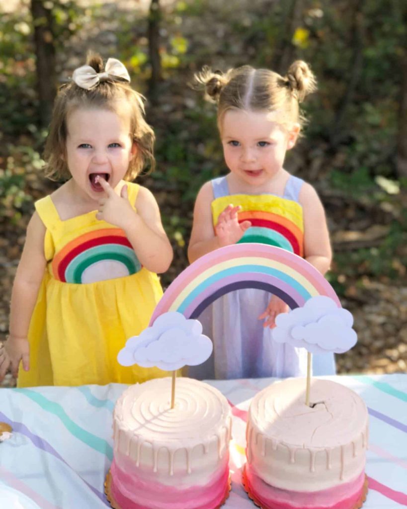 Lila and Hazel eating their double rainbow cake 