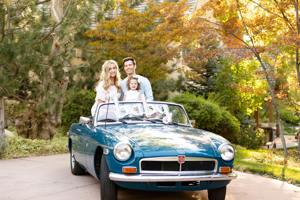 baby boy announcement in classic convertible